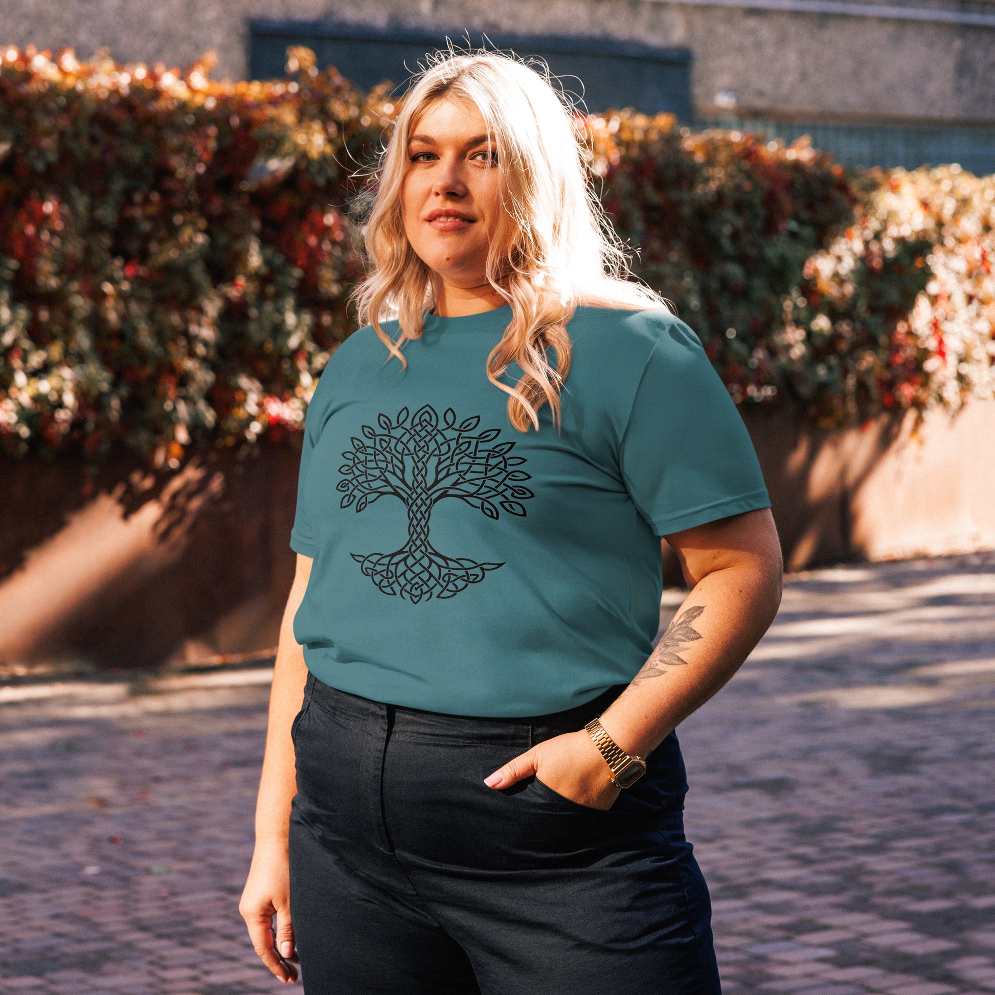 Lifestyle photo of Celtic Tree of Life organic unisex cotton t-shirt with black tree design on chest, color: stargazer