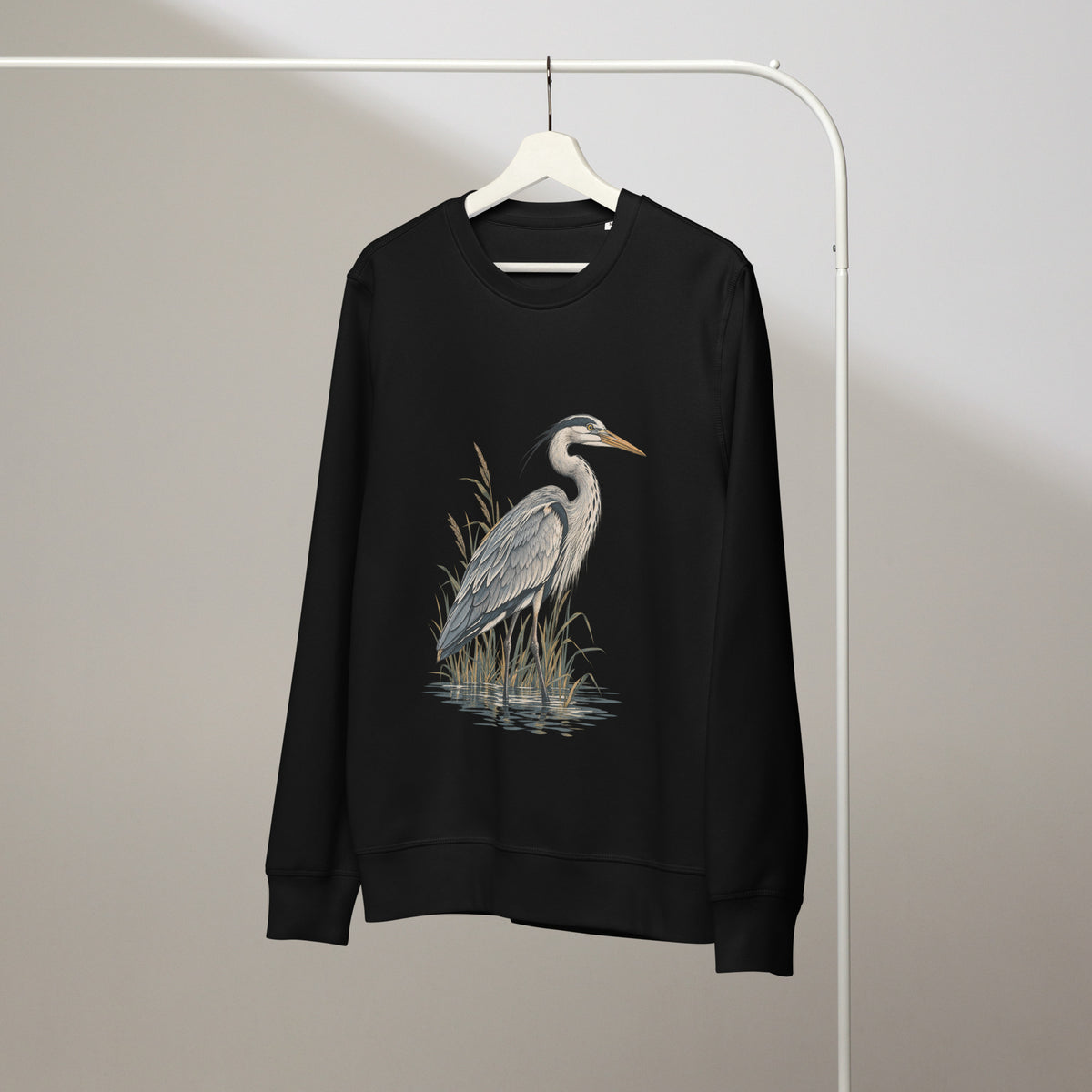 Wardrobe view of a black organic cotton sweatshirt with Grey Heron illustration designed by Gaia's Harmony. Color: black