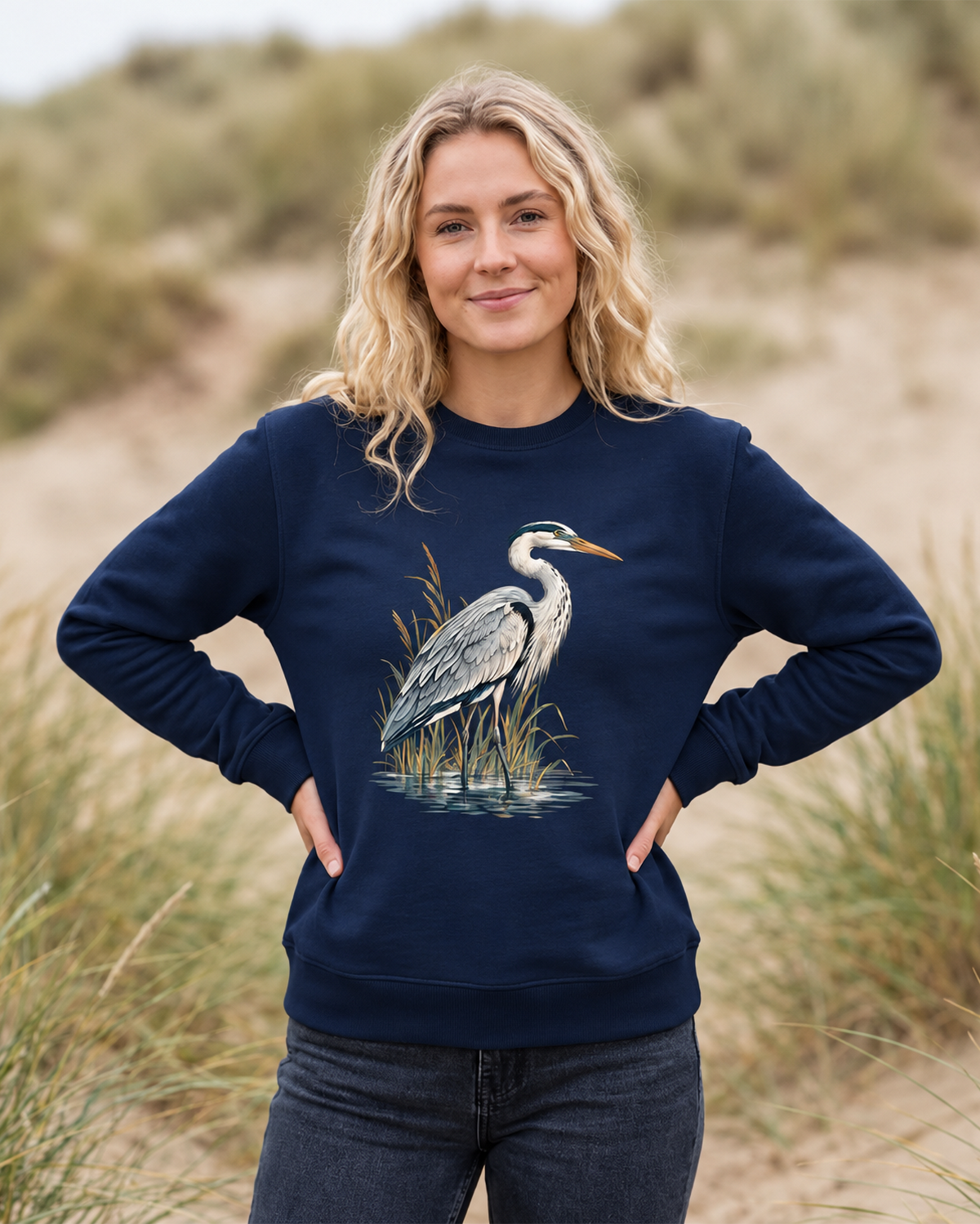 Lifestyle photo of model wearing French Navy organic cotton sweatshirt with Grey Heron illustration designed by Gaia's Harmony. Color: french navy