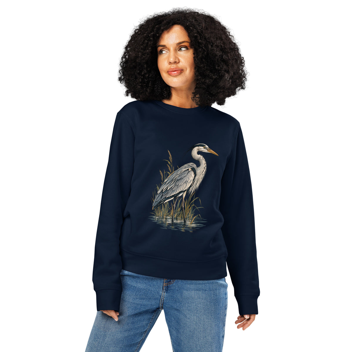 Lifestyle photo of woman wearing French Navy organic cotton sweatshirt with Grey Heron illustration designed by Gaia's Harmony. Color: french navy