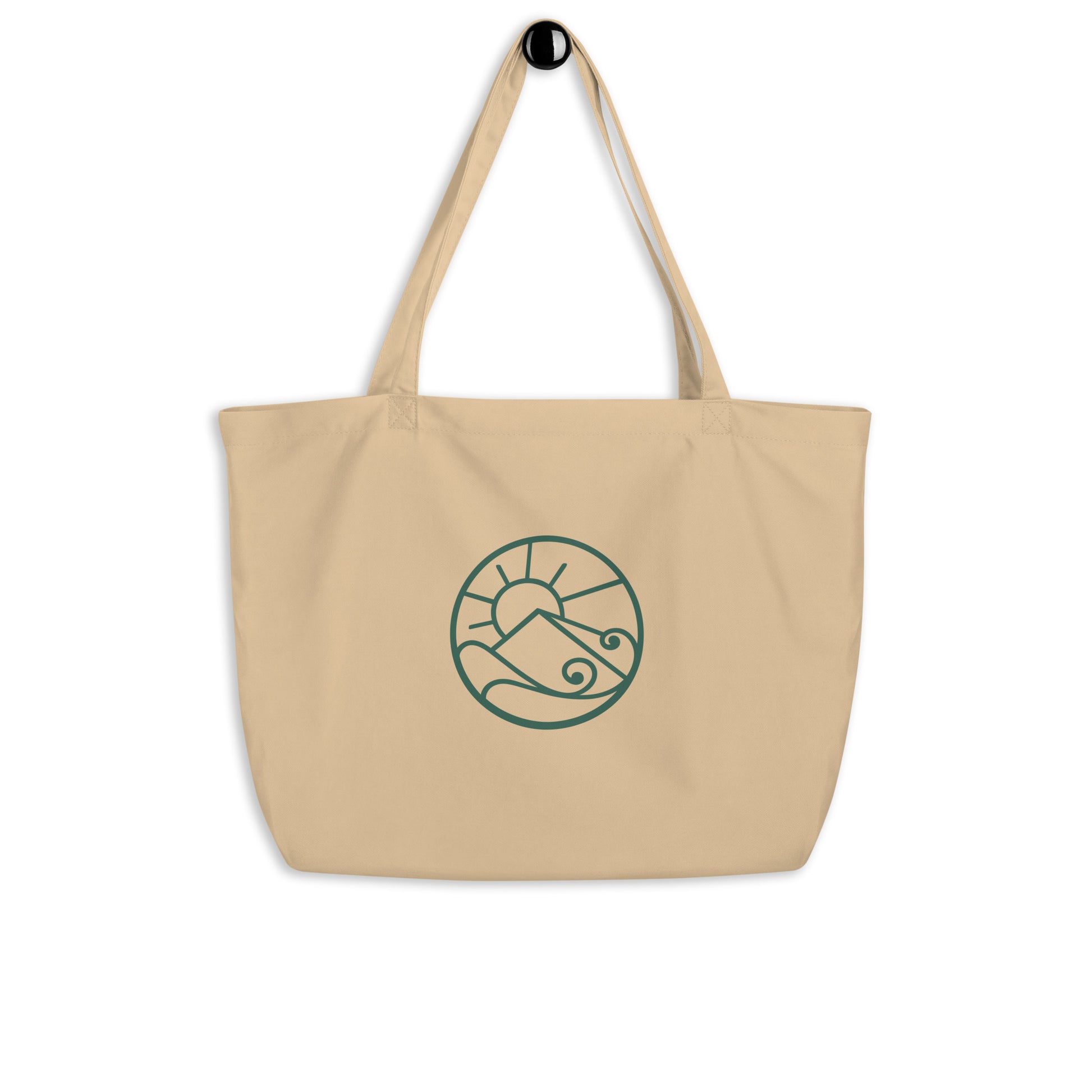 Front hanging view of Large organic cotton tote bag with green Gaia’s Harmony logo on natural canvas fabric
