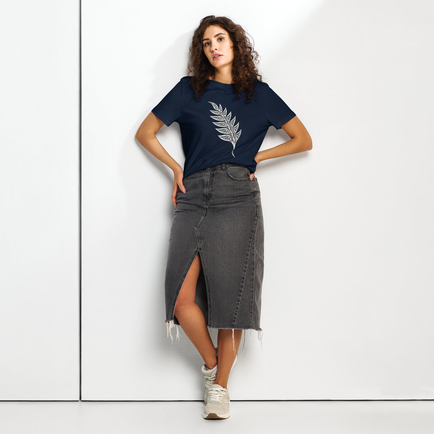Lifestyle photo of Organic green unisex T-shirt featuring an intricate white line art fern frond inspired by the woodlands of West Cork - color: french navy