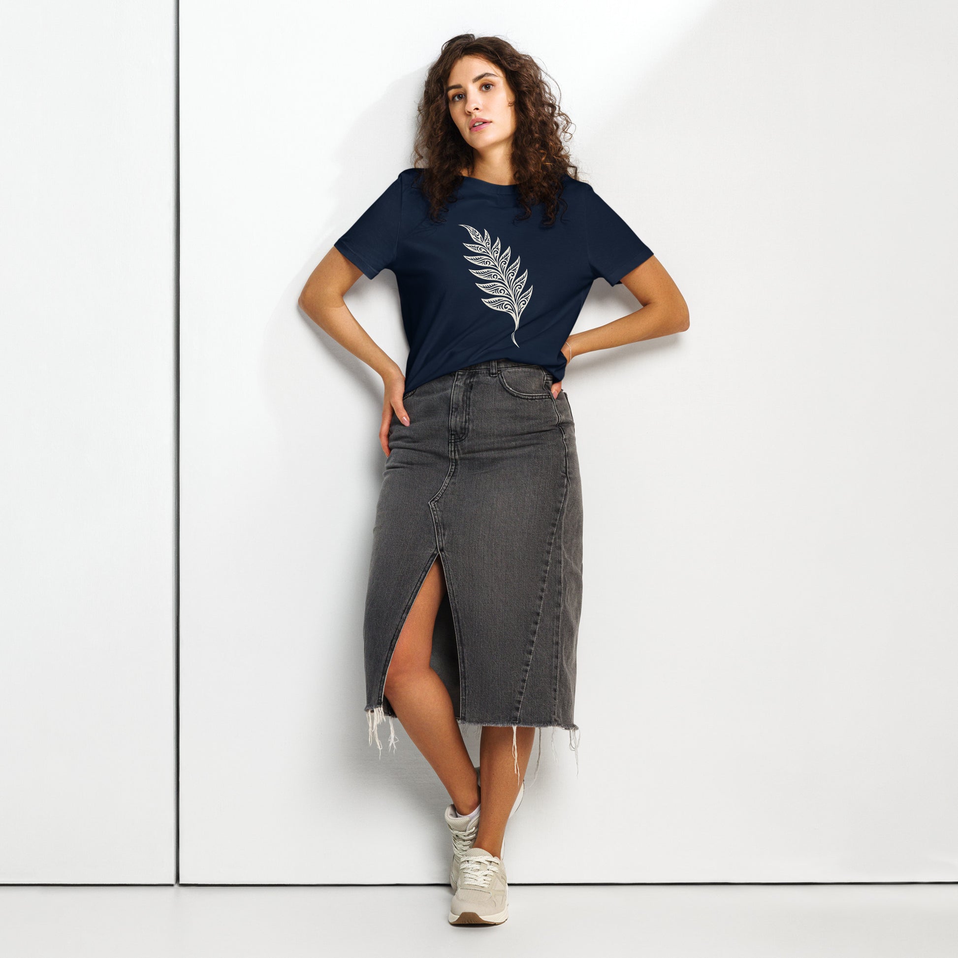 Lifestyle photo of Organic green unisex T-shirt featuring an intricate white line art fern frond inspired by the woodlands of West Cork - color: french navy