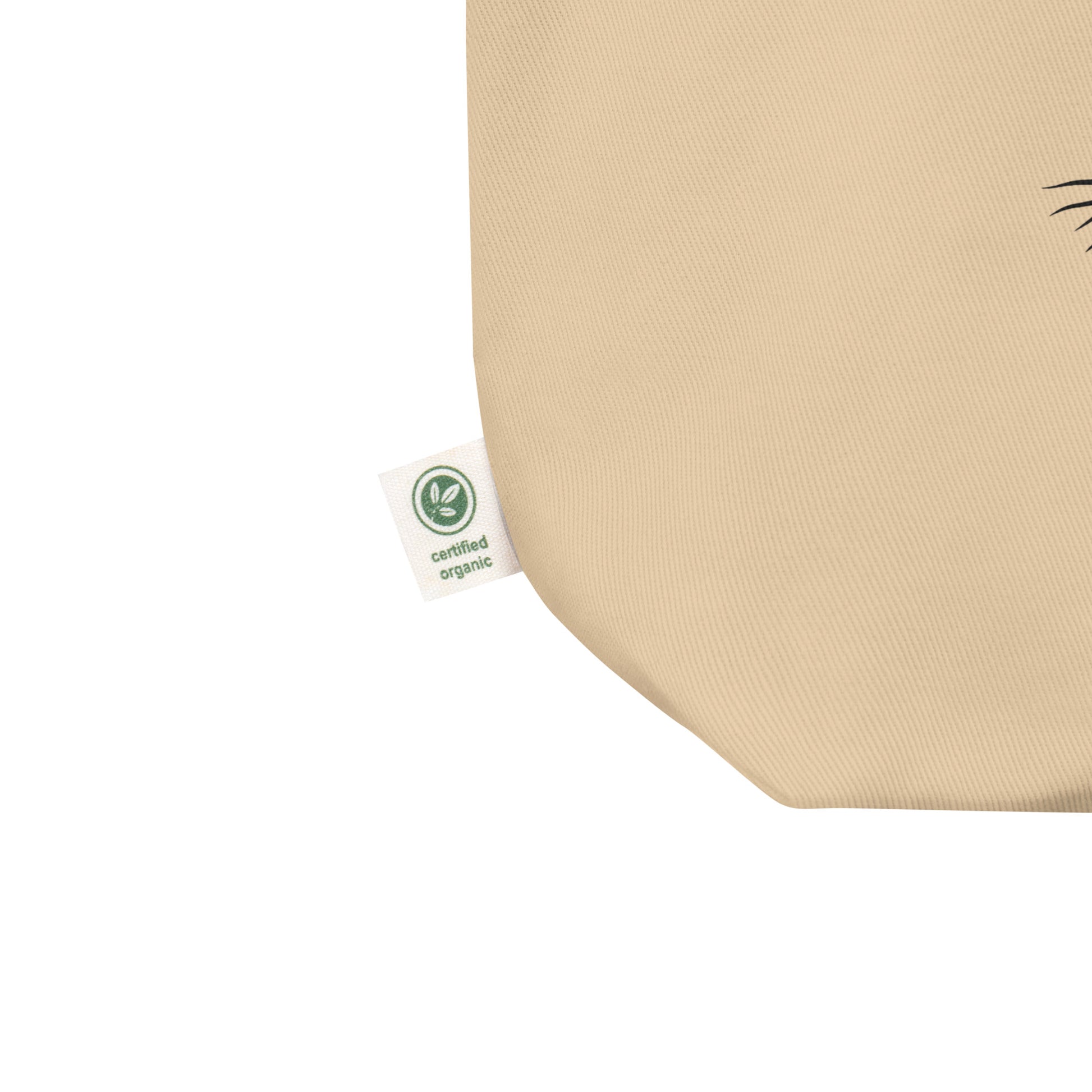 Certified label view of Tree of Life organic cotton tote bag in natural beige with black rooted tree graphic centered on front
