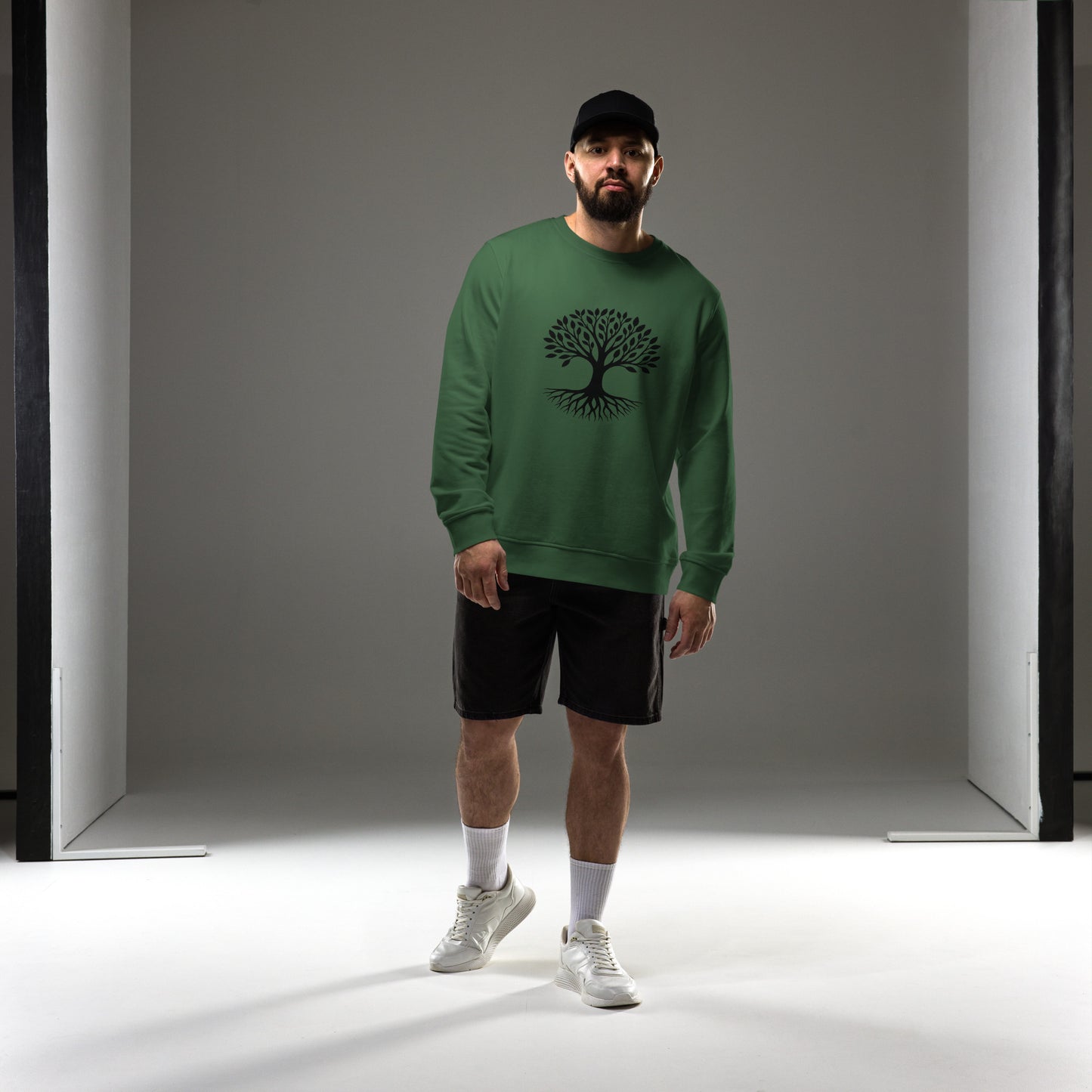 Lifestyle photo of Tree of Life organic sweatshirt with minimalist tree graphic – unisex crewneck – color: bottle green