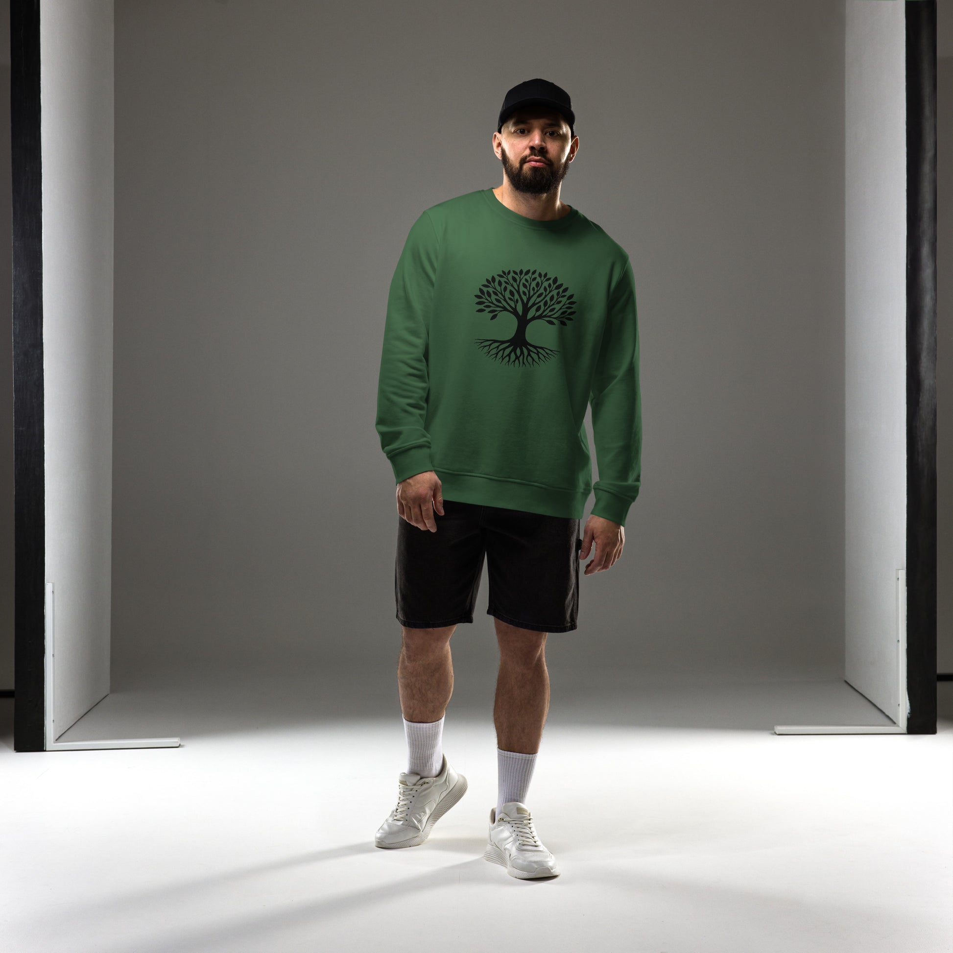 Lifestyle photo of Tree of Life organic sweatshirt with minimalist tree graphic – unisex crewneck – color: bottle green