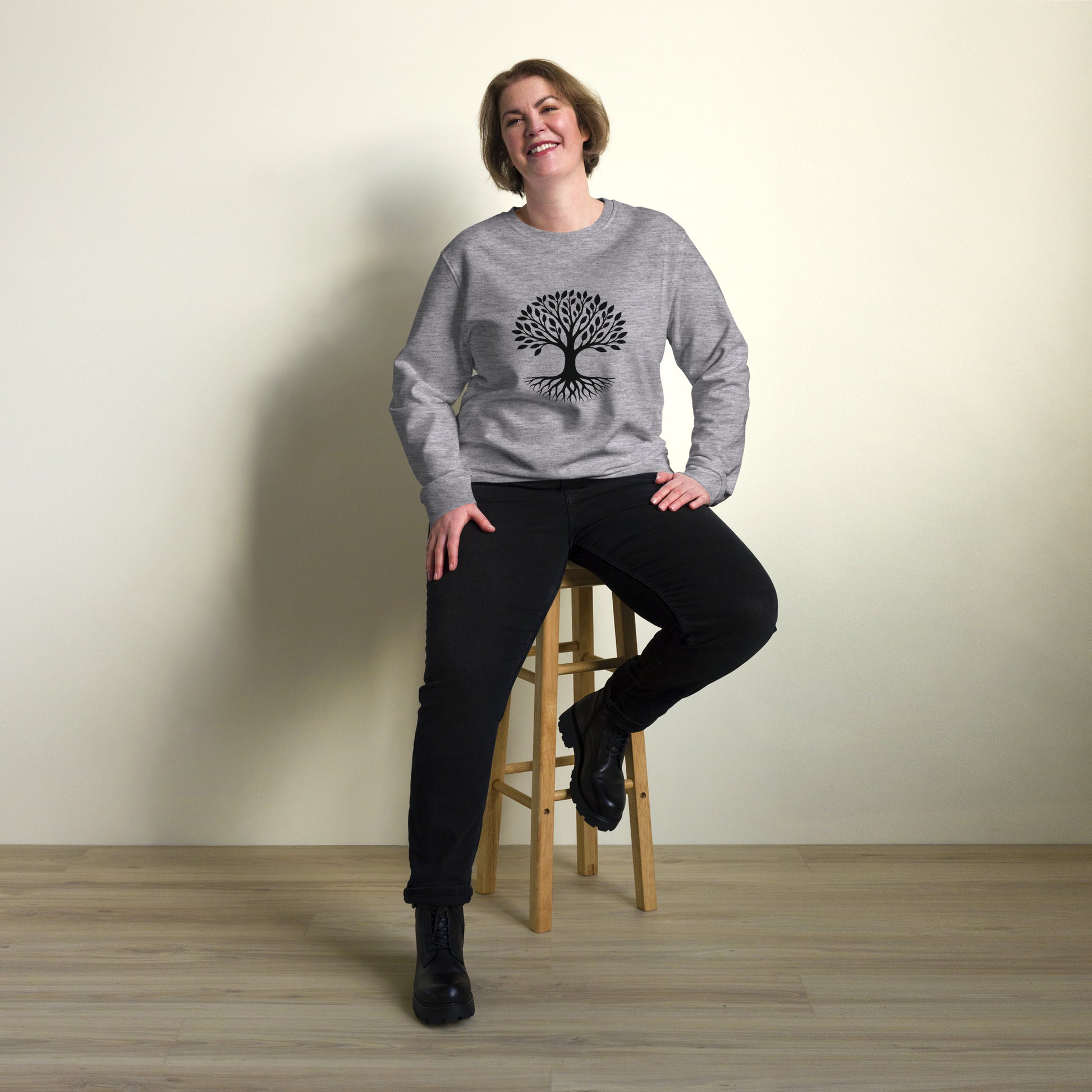 Lifestyle photo of Tree of Life organic sweatshirt with minimalist tree graphic – unisex crewneck – color: grey melange