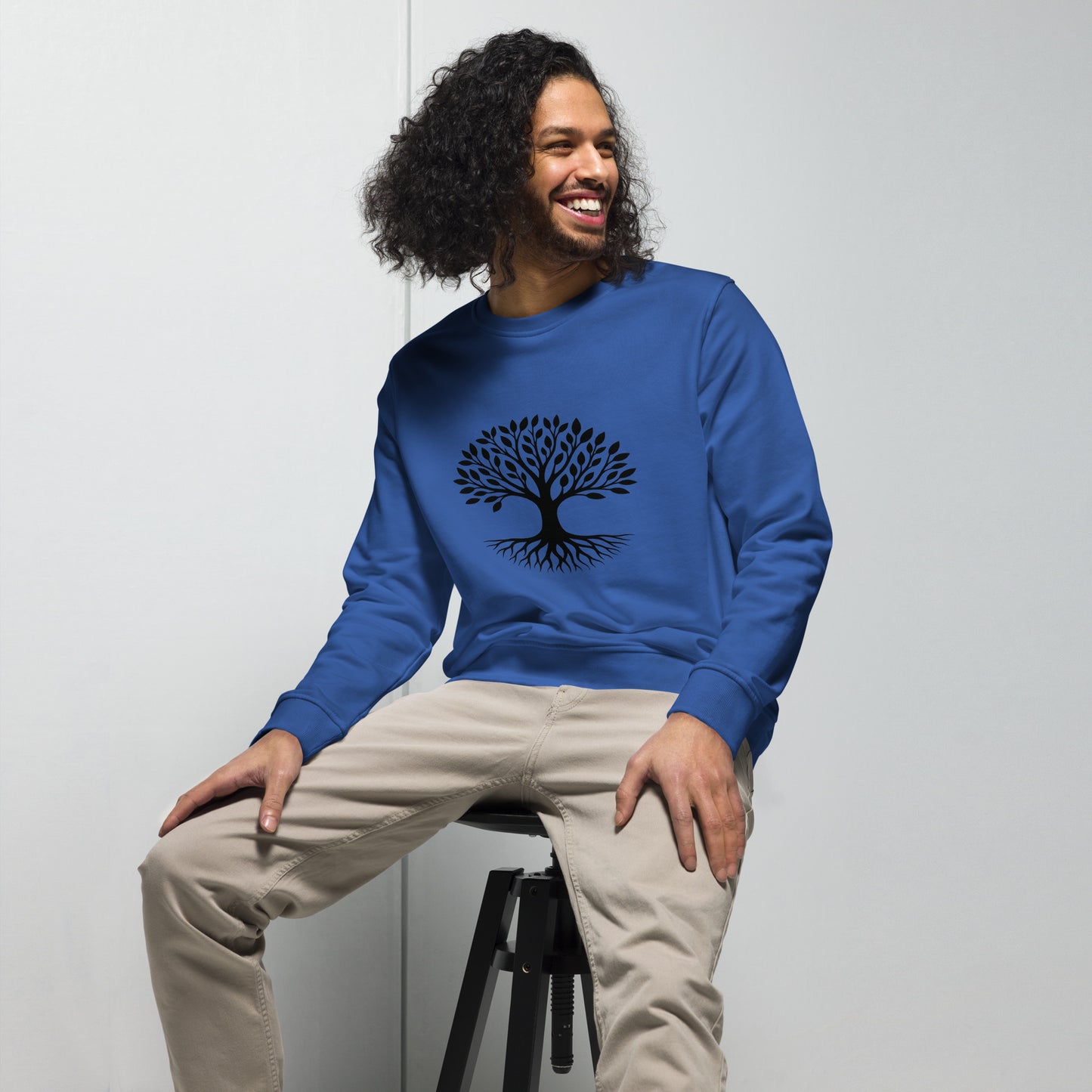 Lifestyle photo of Tree of Life organic sweatshirt with minimalist tree graphic – unisex crewneck – color: royal blue